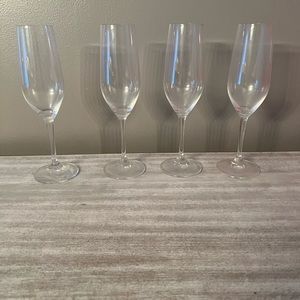 Set of four riedel champagne flutes.